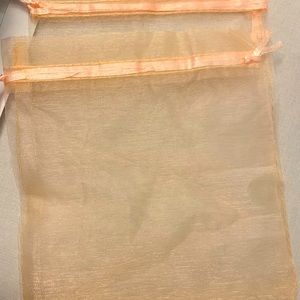 Light peach 5x7 organza bags. Says champagne color - it’s a light peach.